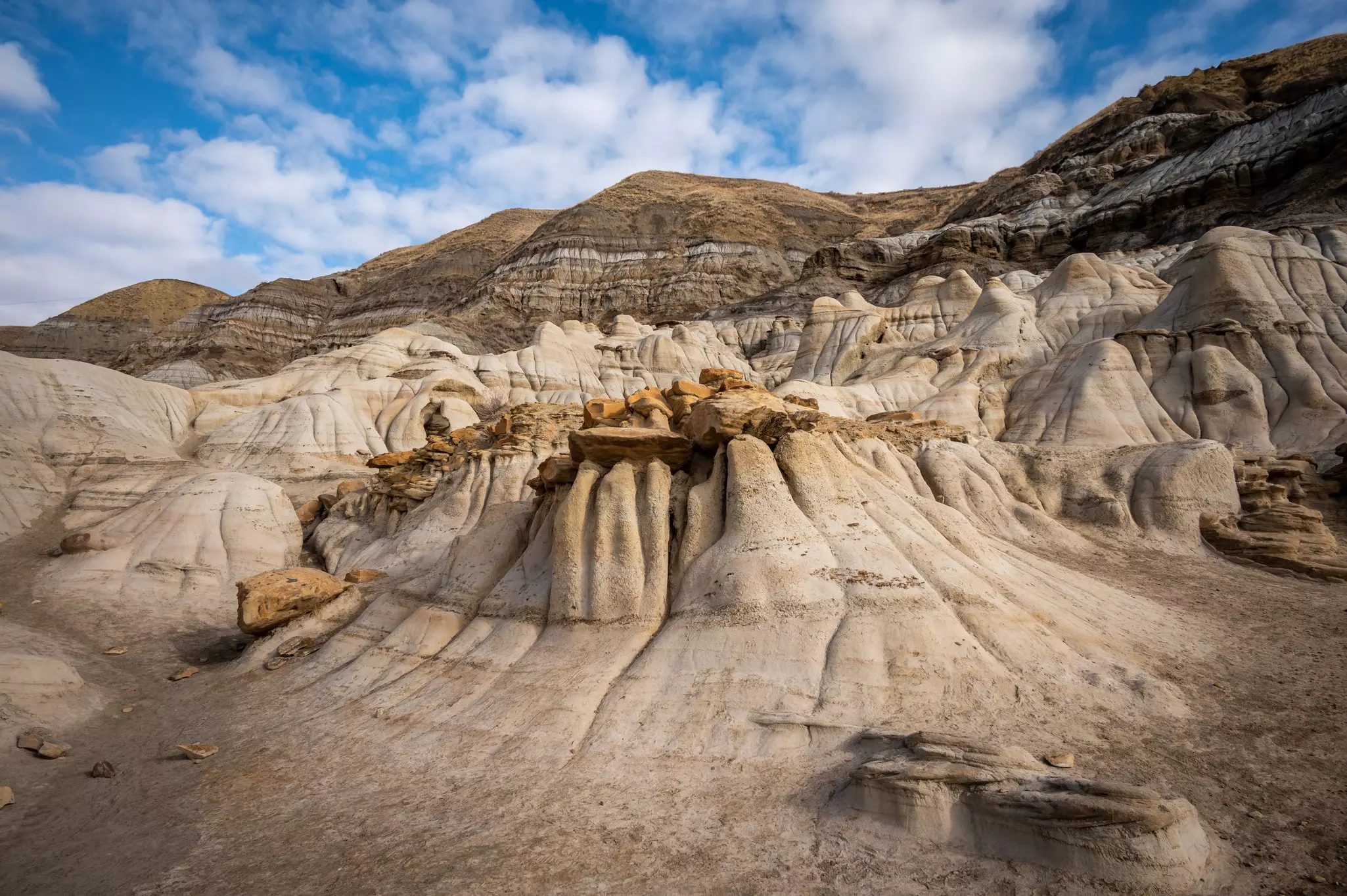 Hoodoos outside of Drumheller, Alberta on a blue sky day.