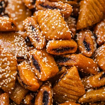 Close-up of makroudh, traditional Tunisian sweets, mainly made of durum wheat semolina, olive oil, dates, then deep fried in oil and soaked in honey syrup.