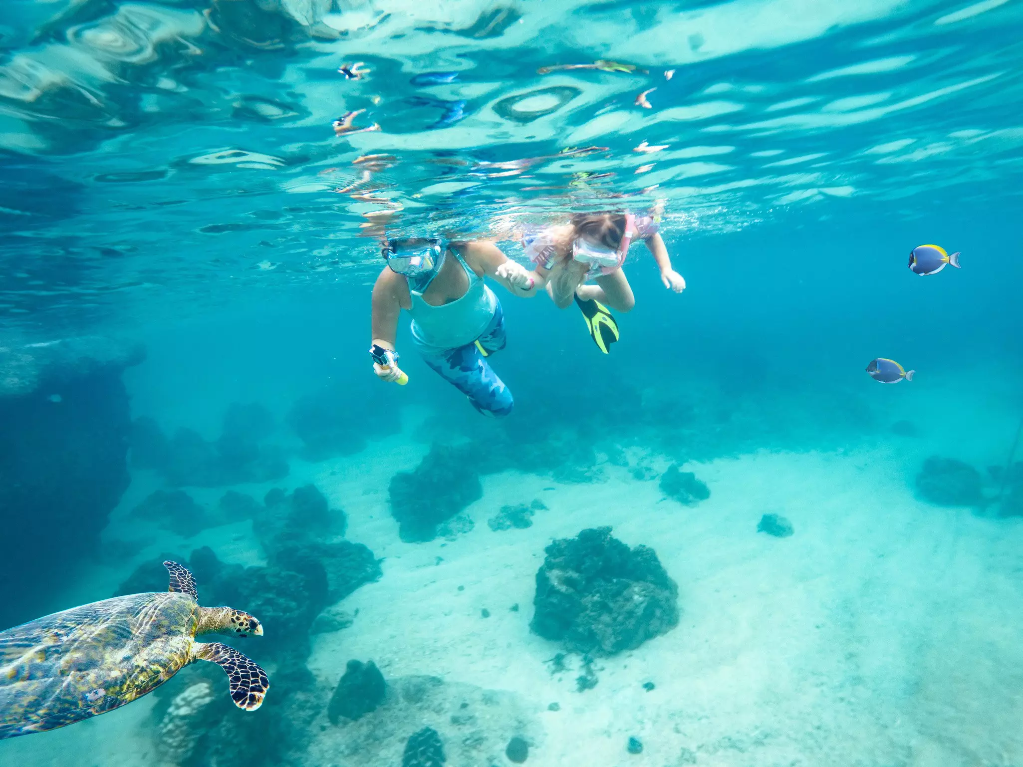 Mother and daughter scuba diving in Little Cayman