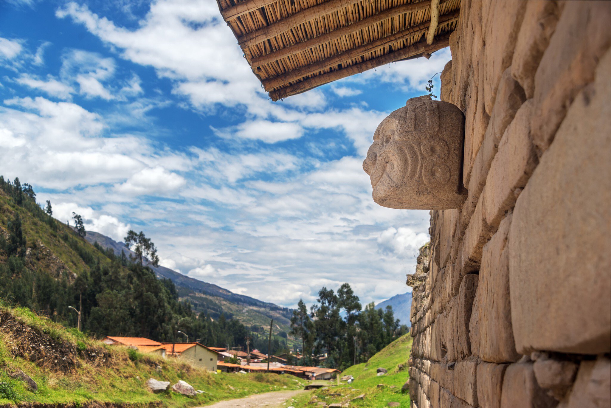 A carved stone mask on the ancient temple at Chavin de Huantar, Peru