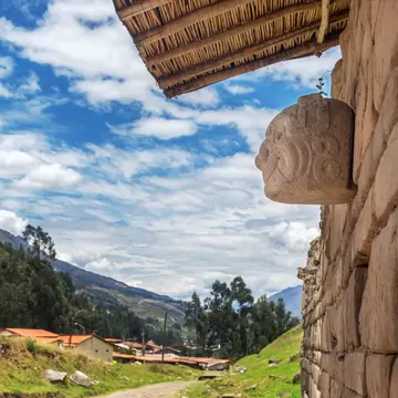 A carved stone mask on the ancient temple at Chavin de Huantar, Peru