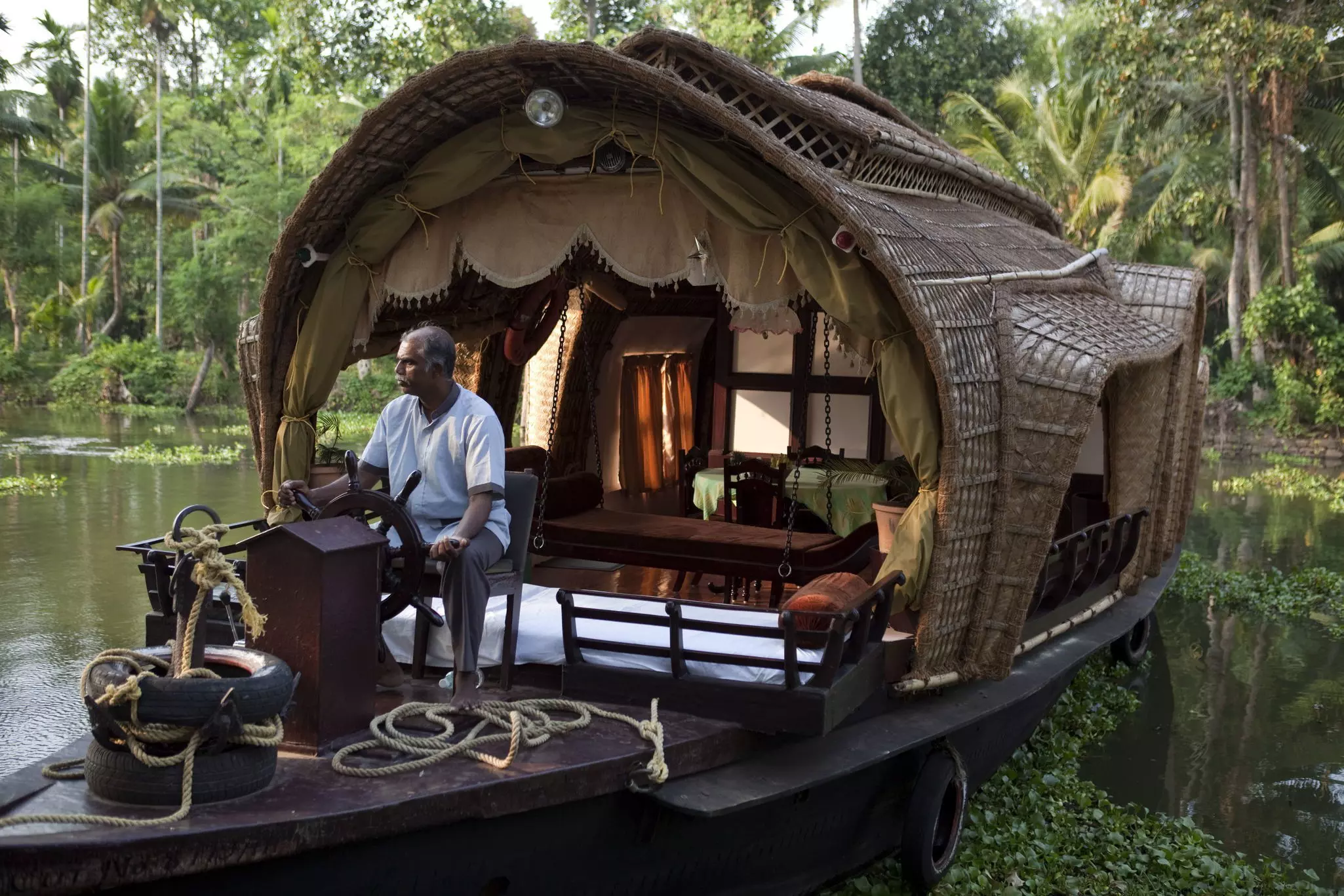 A traditional houseboat in the backwaters of Kerala, India.