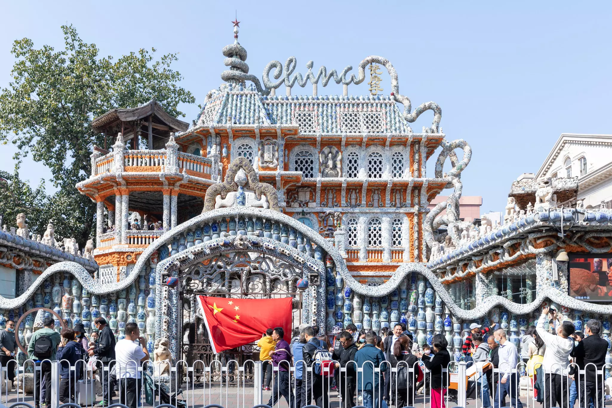 A line of sightseers in front of the Porcelain House in Tianjin China.