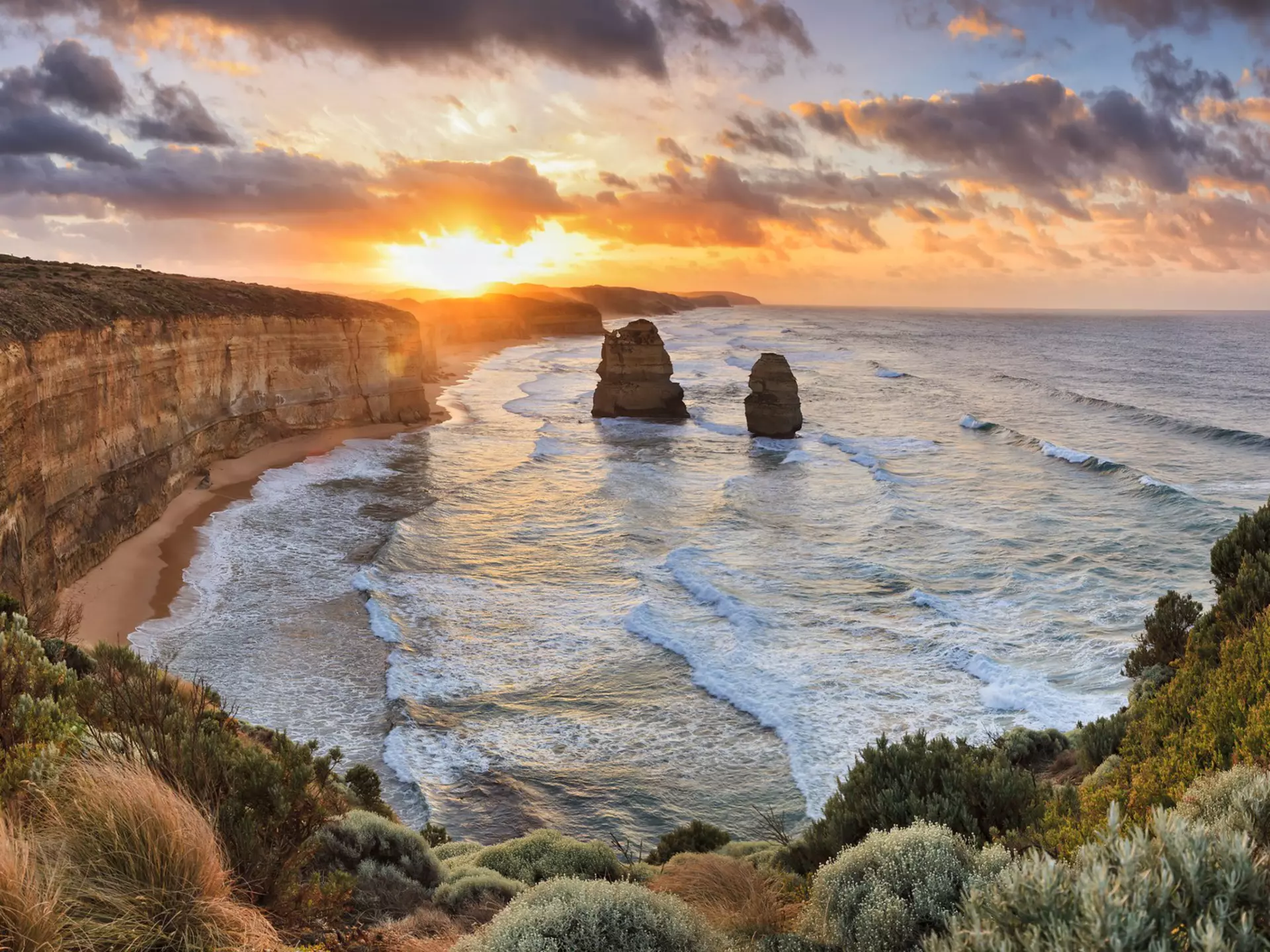 Two of Twelve Apostles rock formations in sea, Great Ocean Road at sunset