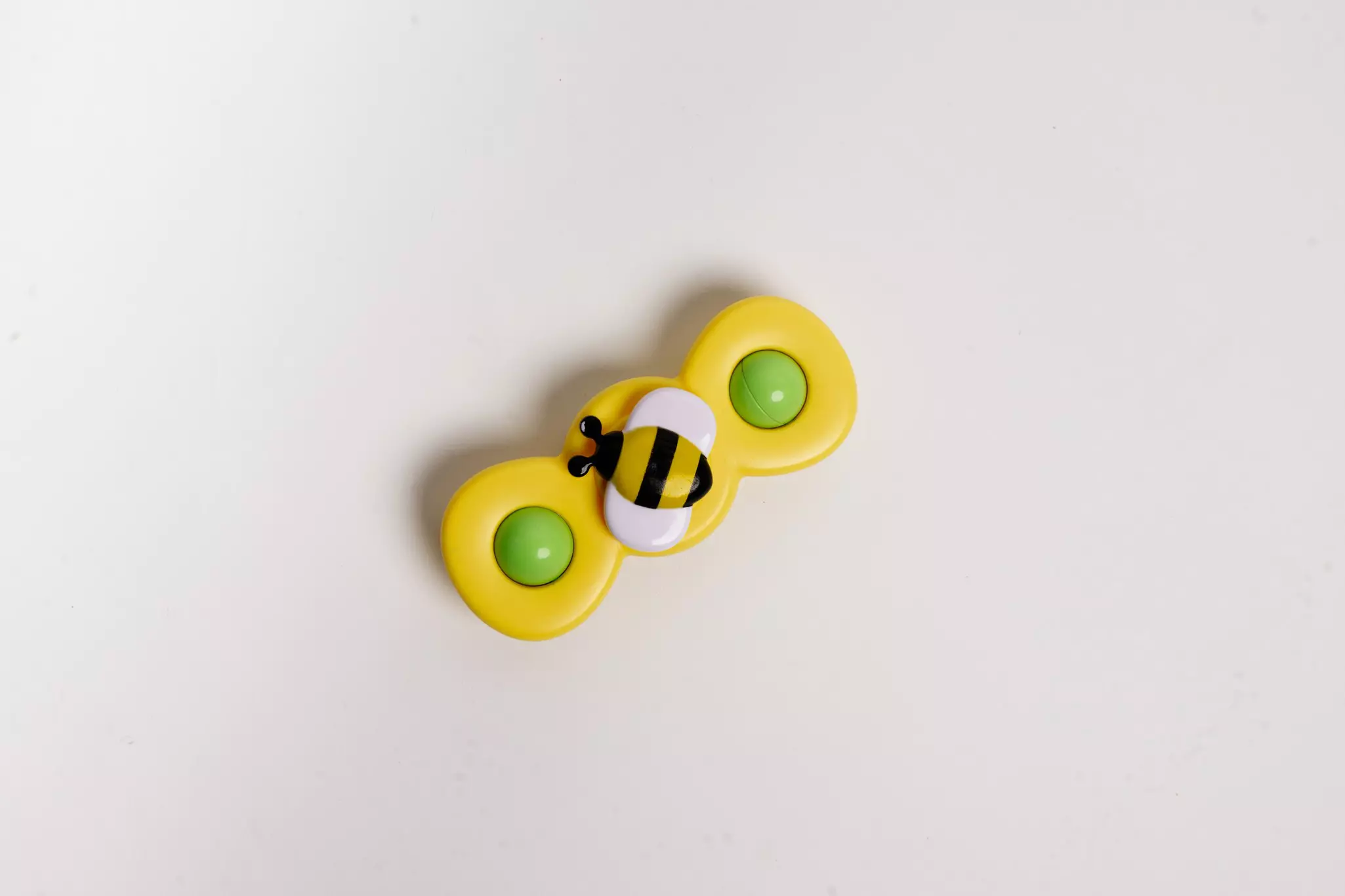 A spinner with a bee on it.