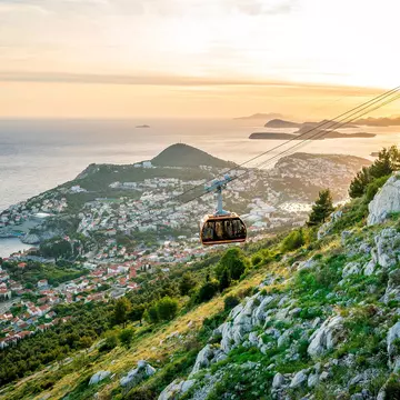 Dubrovnik's cable car traveling up Mt Srđ at sunset. Samantha Ohlsen/Alamy Stock Photo