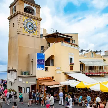 Tourists visit Piazza Umberto I, the most famous square of the island of Capri.