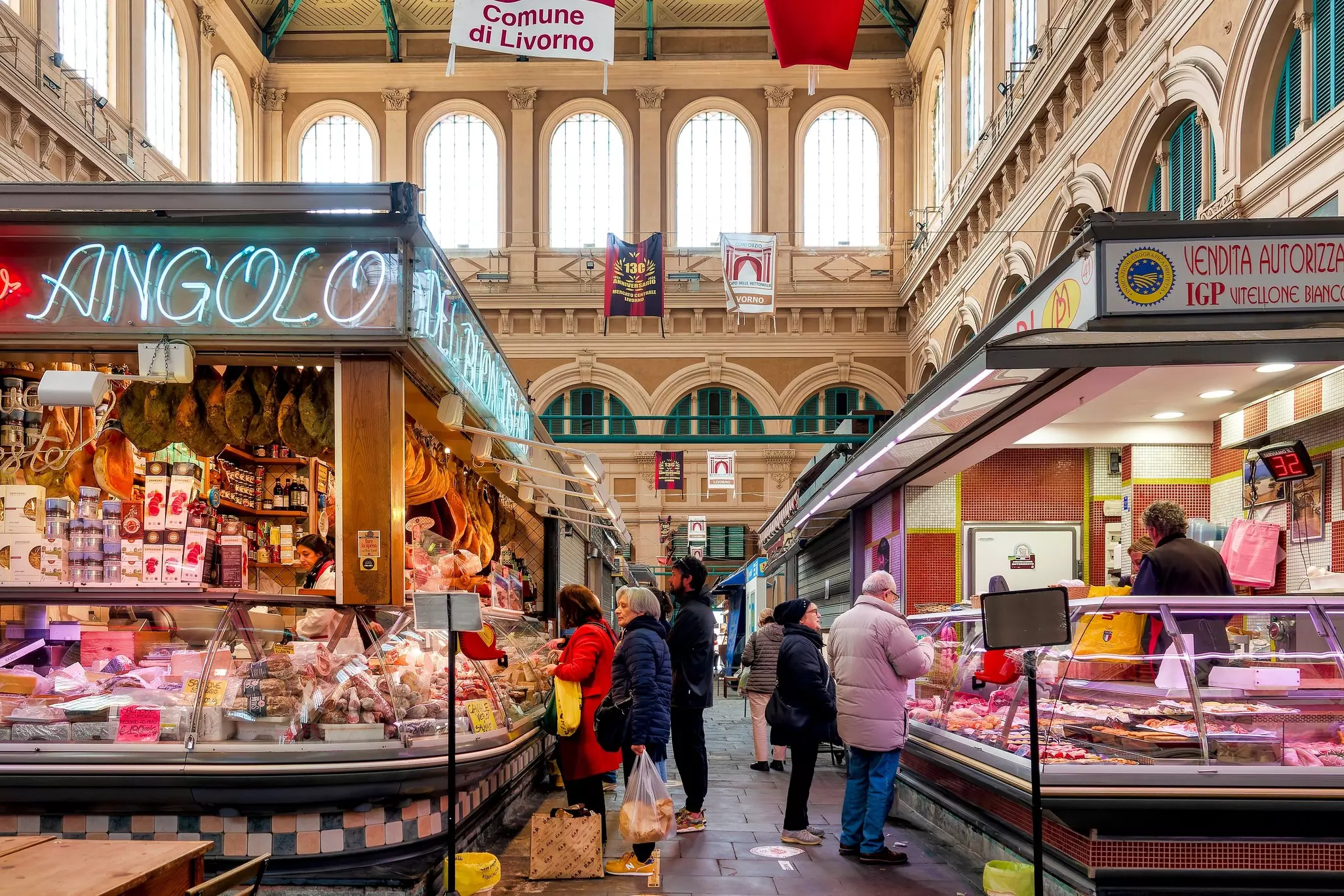 Deli counters at a market in Livorno, Tuscany, Italy.