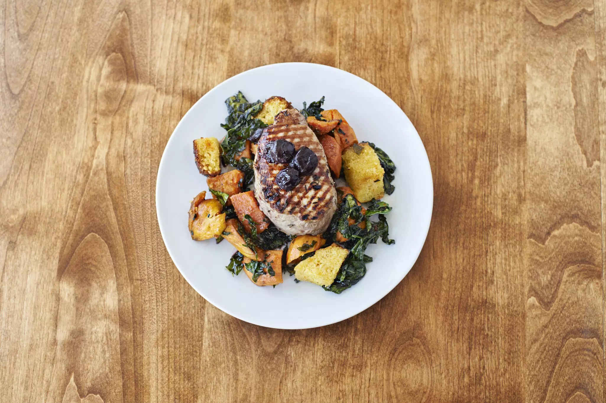 A well-presented pork dish from Ostrich Farm's menu.