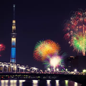 Summer fireworks over the Sumida river at night in Tokyo, Japan