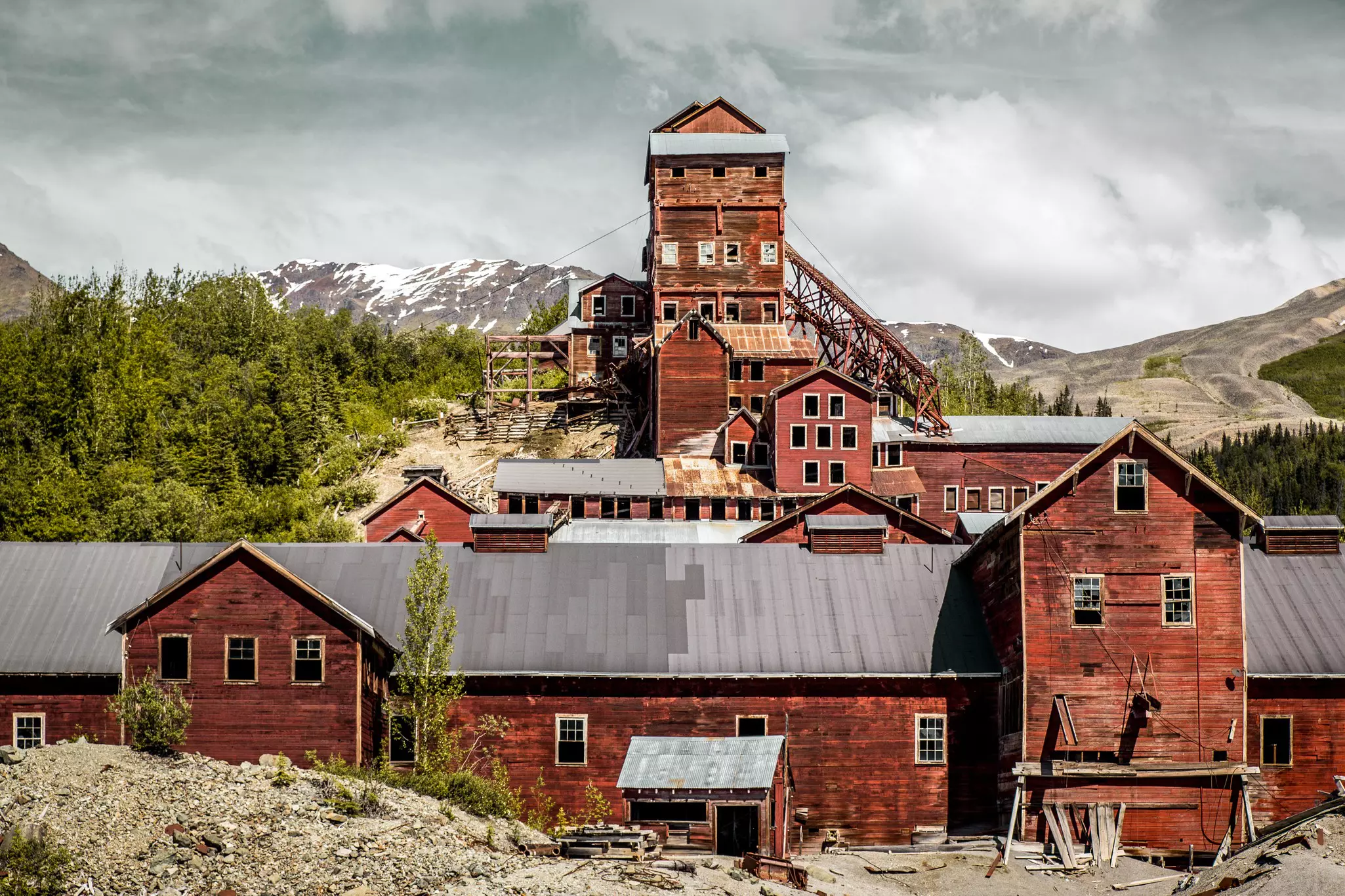 An abandoned industrial building in a mountainous region