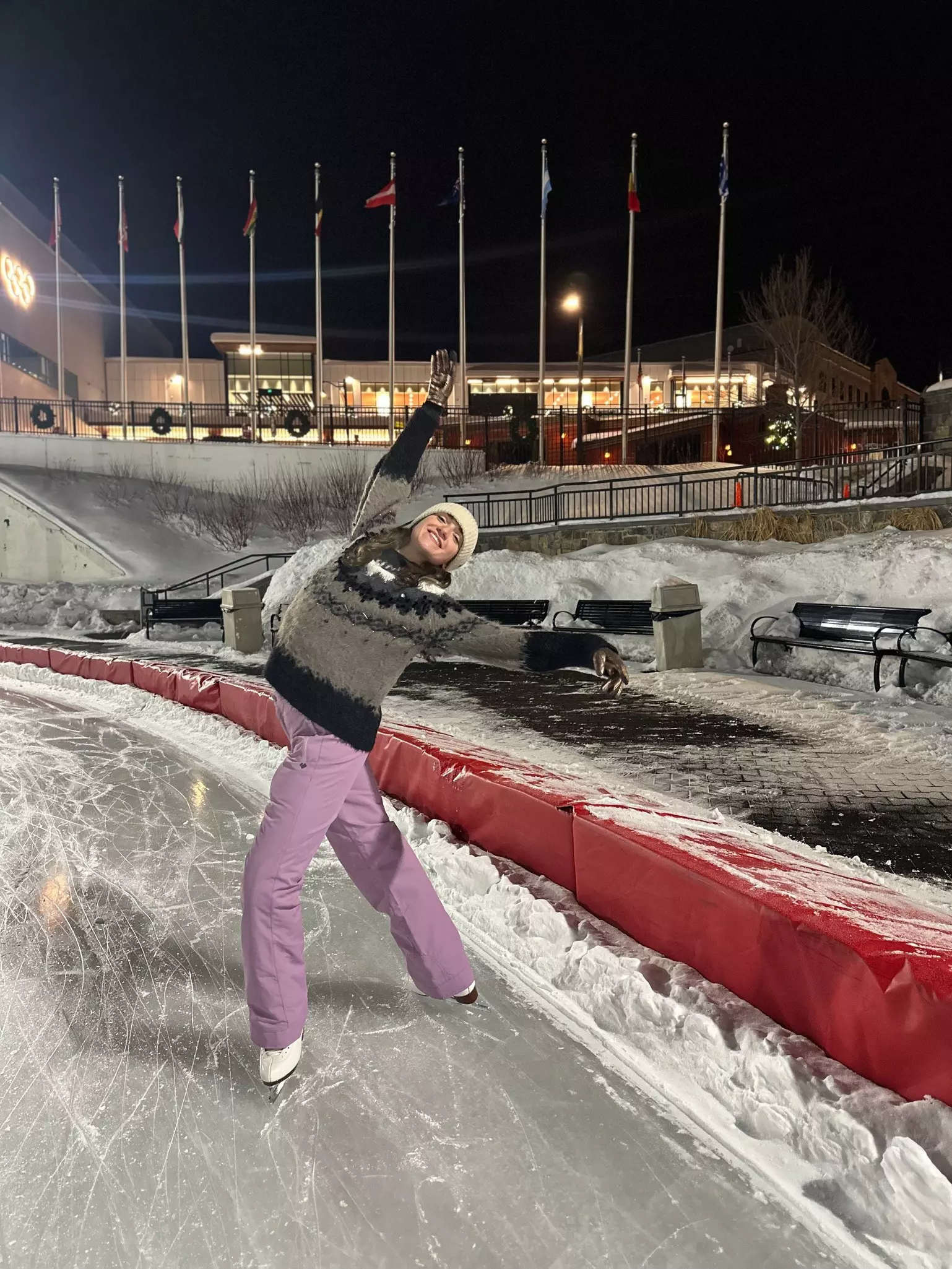 Woman poses on the an ice skating rink at the Olympic Oval Ice Skating rink