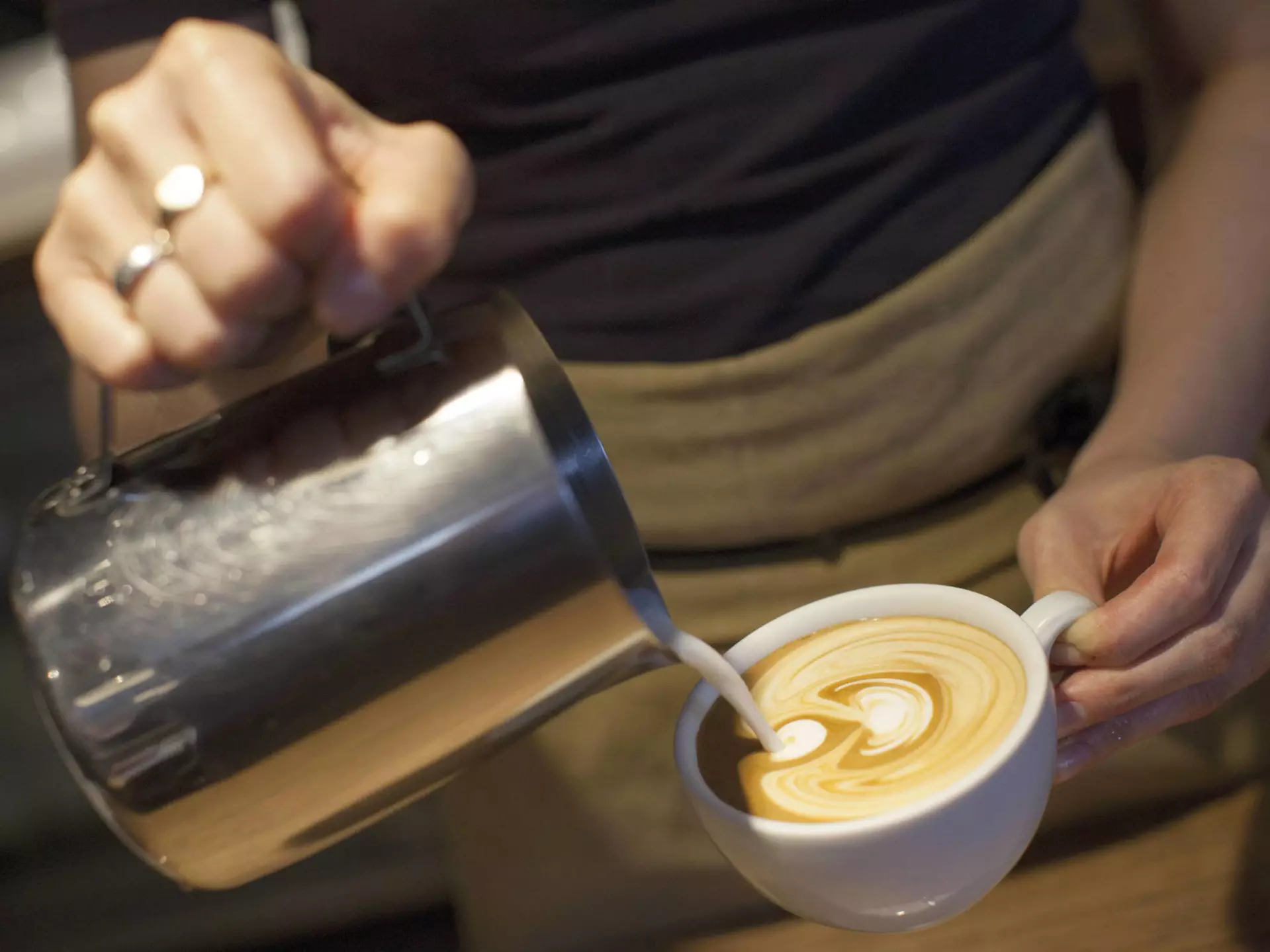 A barista pours a coffee at Monmouth Coffee Company.
