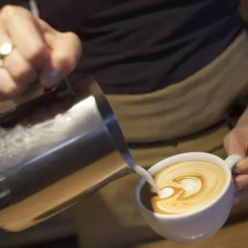 A barista pours a coffee at Monmouth Coffee Company.