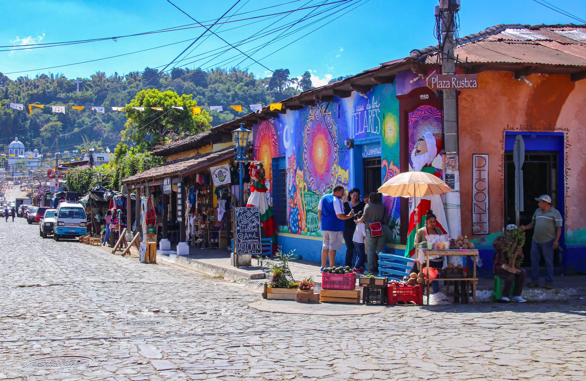 Colorful storefront on the corner of a road made of stones