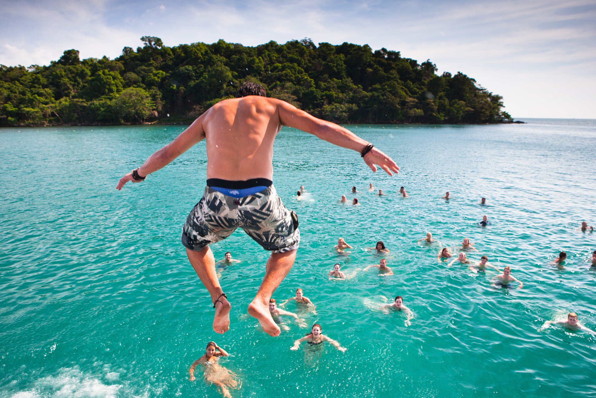 A popular activity in Sihanoukville, Cambodia is the Dolphin Shack booze cruise which takes backpackers out to swim and party at various islands