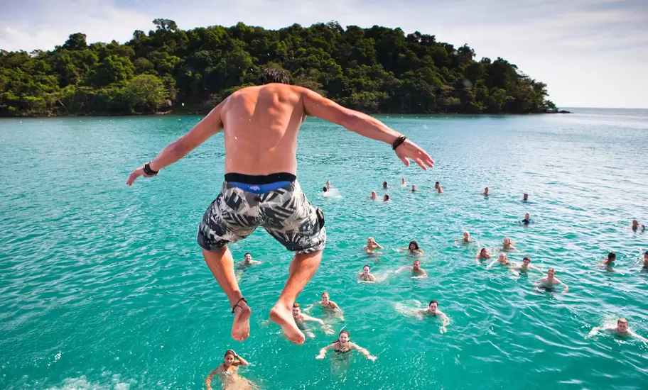 A popular activity in Sihanoukville, Cambodia is the Dolphin Shack booze cruise which takes backpackers out to swim and party at various islands