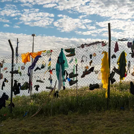  After finishing their pilgrimage at Santiago de Compestla's cathedral, some hikers on the Camino de Santiago leave behind their clothes and boots in Finisterre to signify a new start.