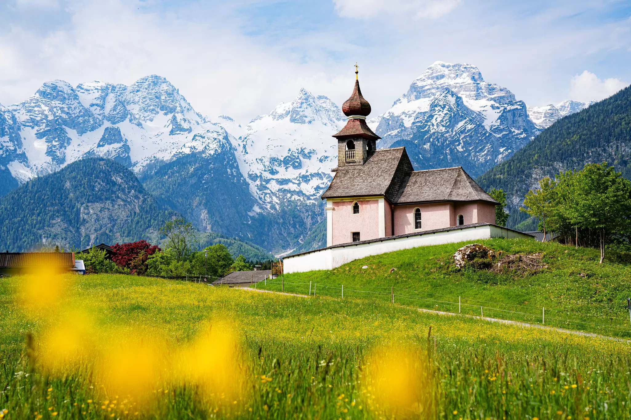 Scenic panoramic view of idyllic Auer Kircherl, an old historical chapel in the alps near the famous old village of Lofer, on a beautiful sunny day with blue sky in spring, Salzburg Land, Austria
