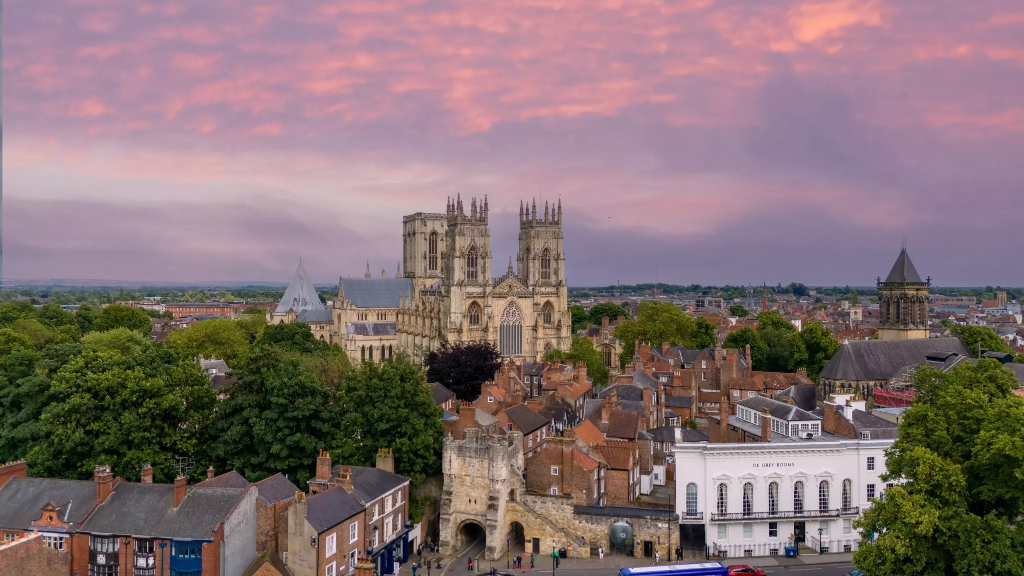 Aerial view of the city of York with the Minster and surrounding historic buildings at sunset.