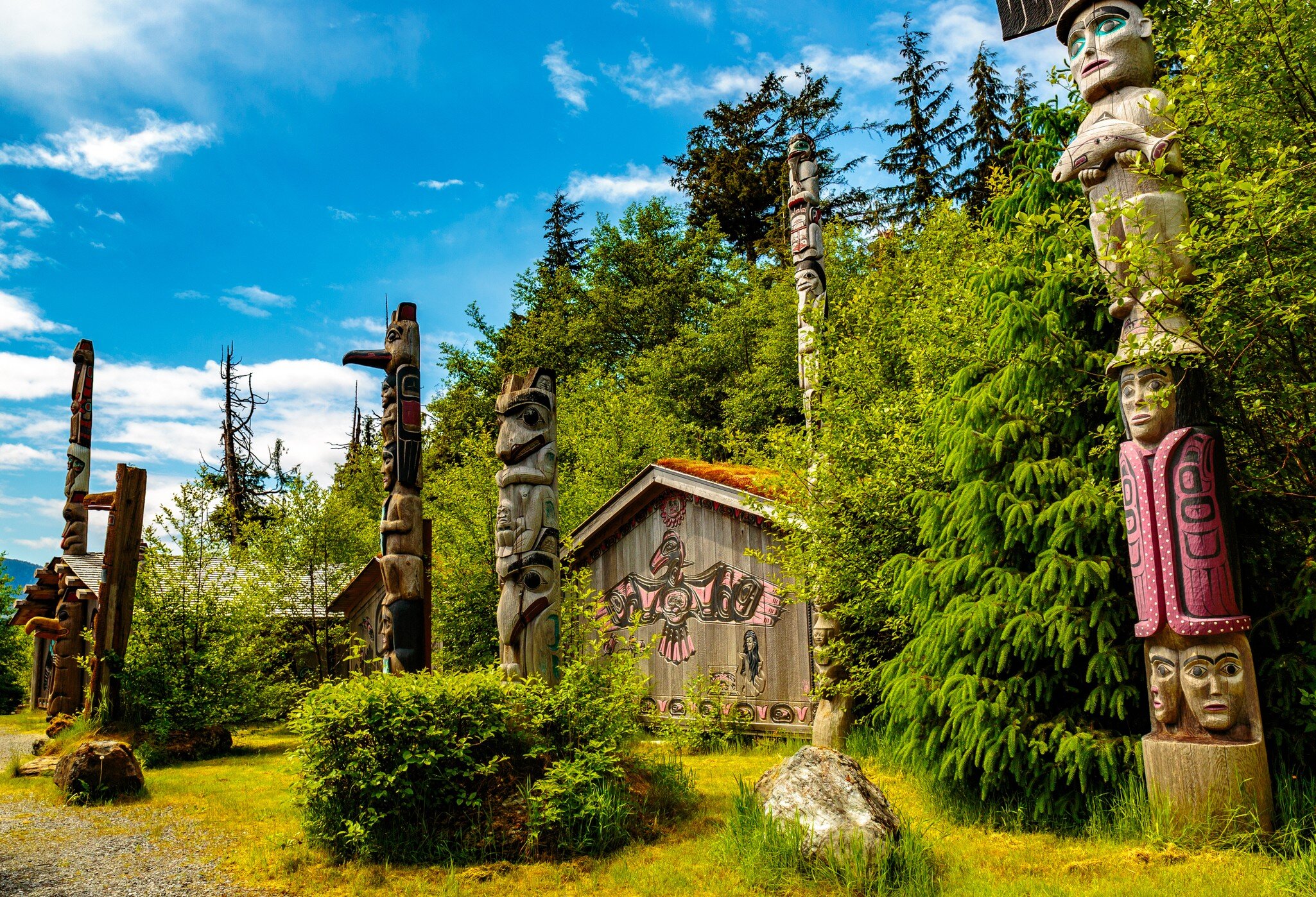 Ketchikan, AK, USA - May 24, 2016:  Native American Totems and Clan Houses located at Totem Bight State Historic Site.