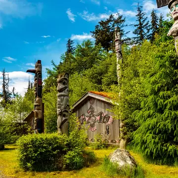 Ketchikan, AK, USA - May 24, 2016:  Native American Totems and Clan Houses located at Totem Bight State Historic Site.