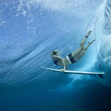 Female Pro surfer at Cloud Break Fiji
