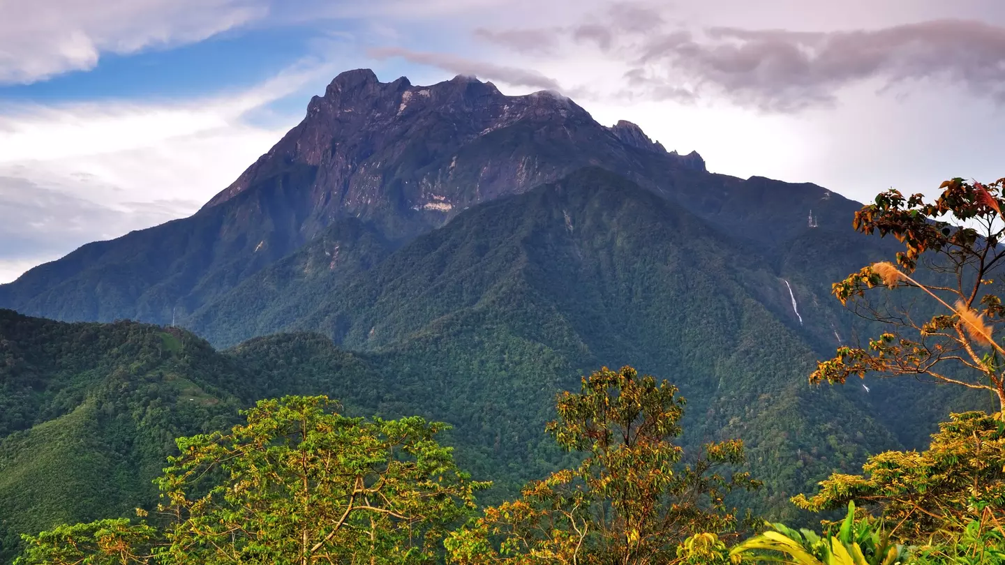 Borneo's Mount Kinabalu, a natural skyscraper with amazing biodiversity, soars into the sky.