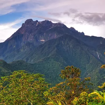 Borneo's Mount Kinabalu, a natural skyscraper with amazing biodiversity, soars into the sky.