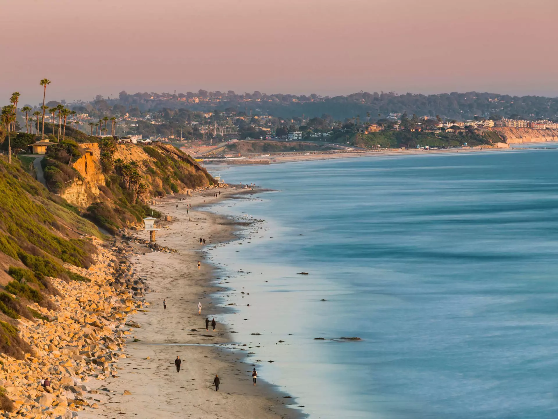 The beach and coastline in Southern California at sunset.