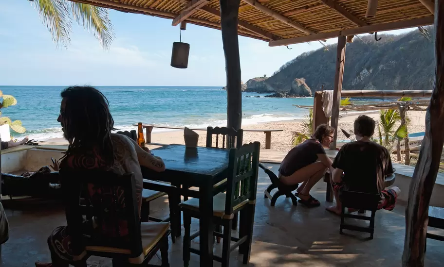 Travelers relaxing at the restaurant at Posada del Arquitecto.