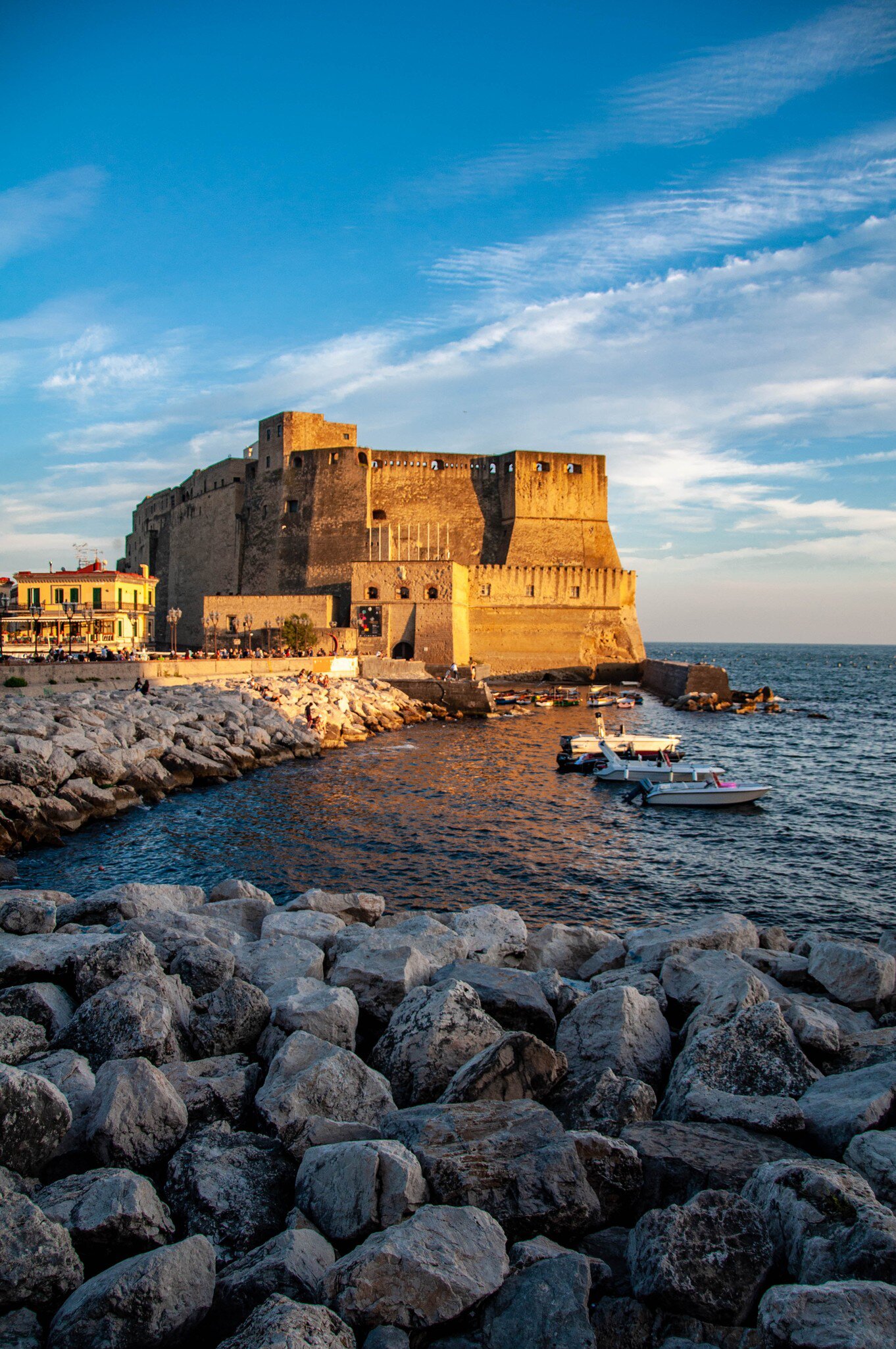 The Castel dell'Ovo photographed from the waterfront during sunset in Naples, Italy.