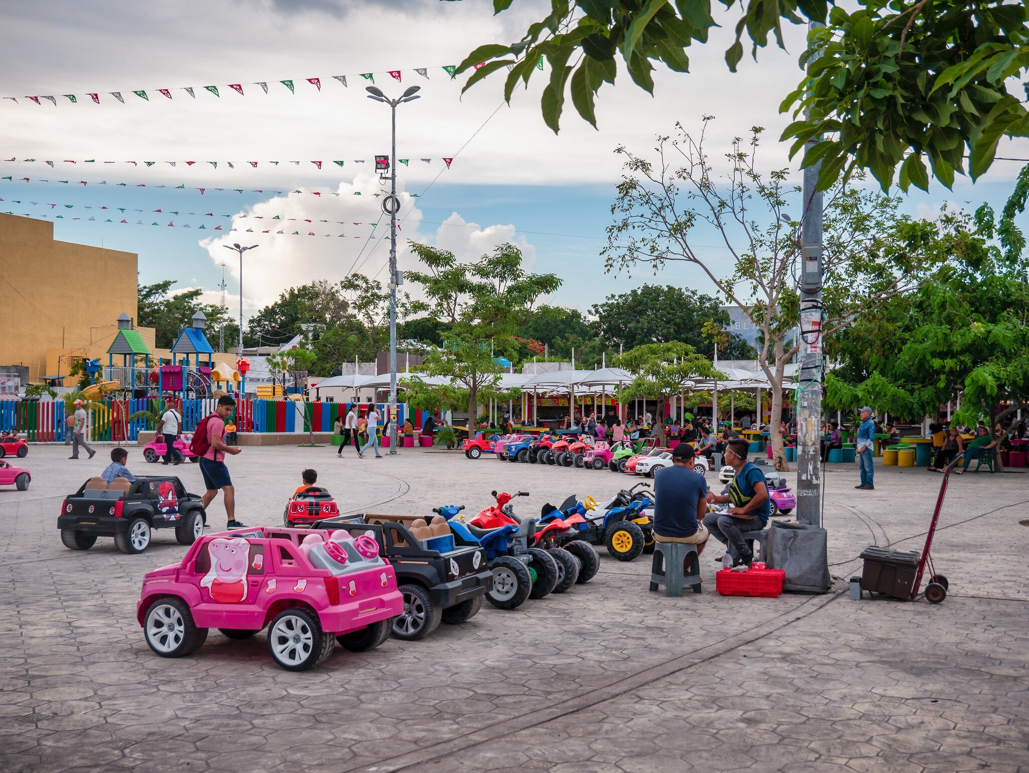 Toy cars operating in the Parque de las Palapas in Cancún, Mexico.