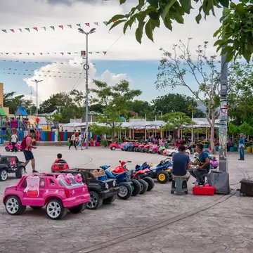 Toy cars operating in the Parque de las Palapas in Cancún, Mexico.
