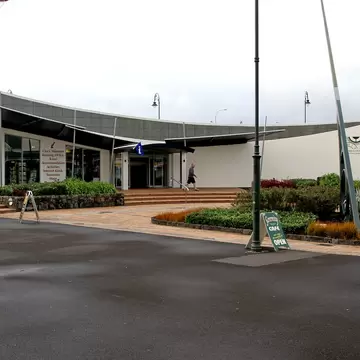 Whangarei Northland New Zealand. Claphams National Clock Musuem. View of front of building. Entrance. Roof slopes to middle point. Angular design, white walls.; Shutterstock ID 1485170792; purchase_order: 65050; job: POIs; client: Lonely Planet; o...
