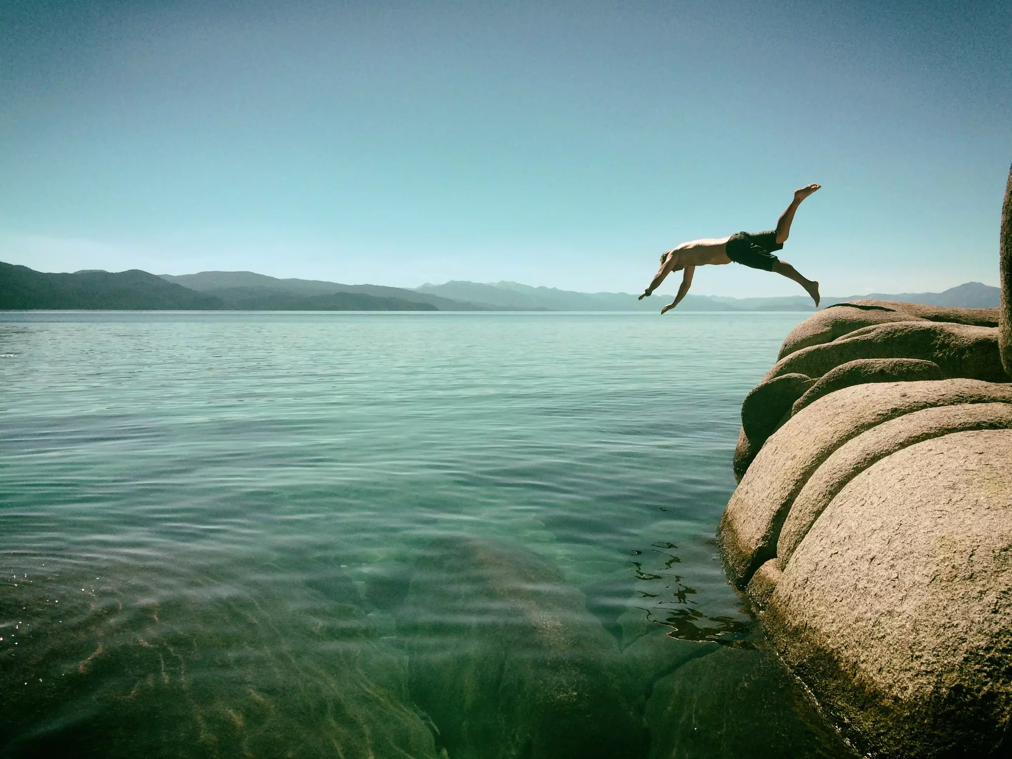 Man jumping into Lake Tahoe, California