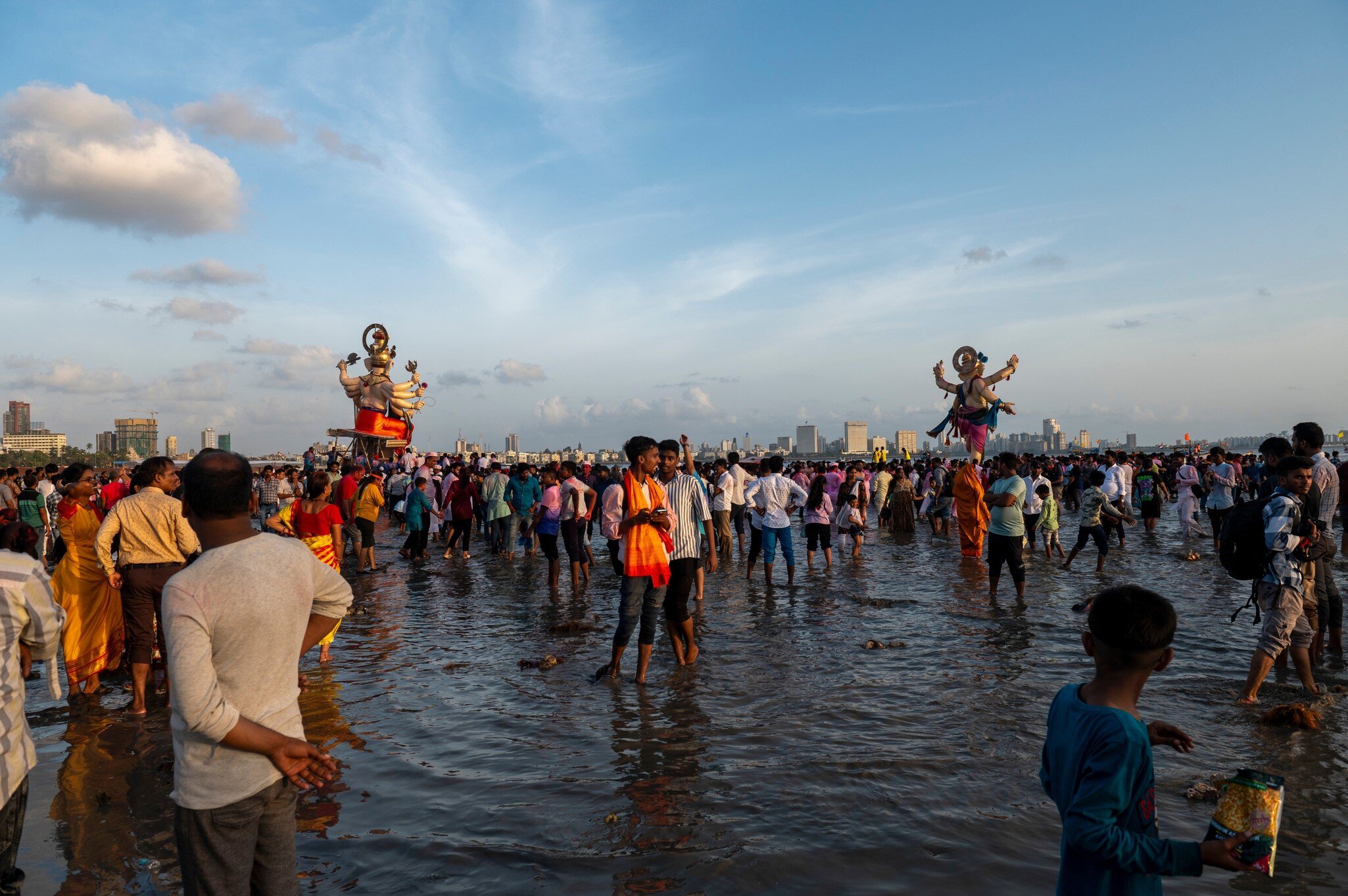 Large size Ganapati or Ganesha idol being carried to the sea for immersion at Girgaon Chowpatty. Mumbai, Maharashtra, India.
