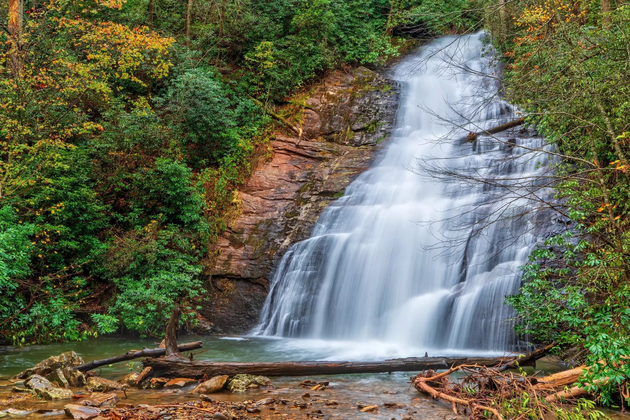 A waterfall surrounded by trees in Helton Creek.