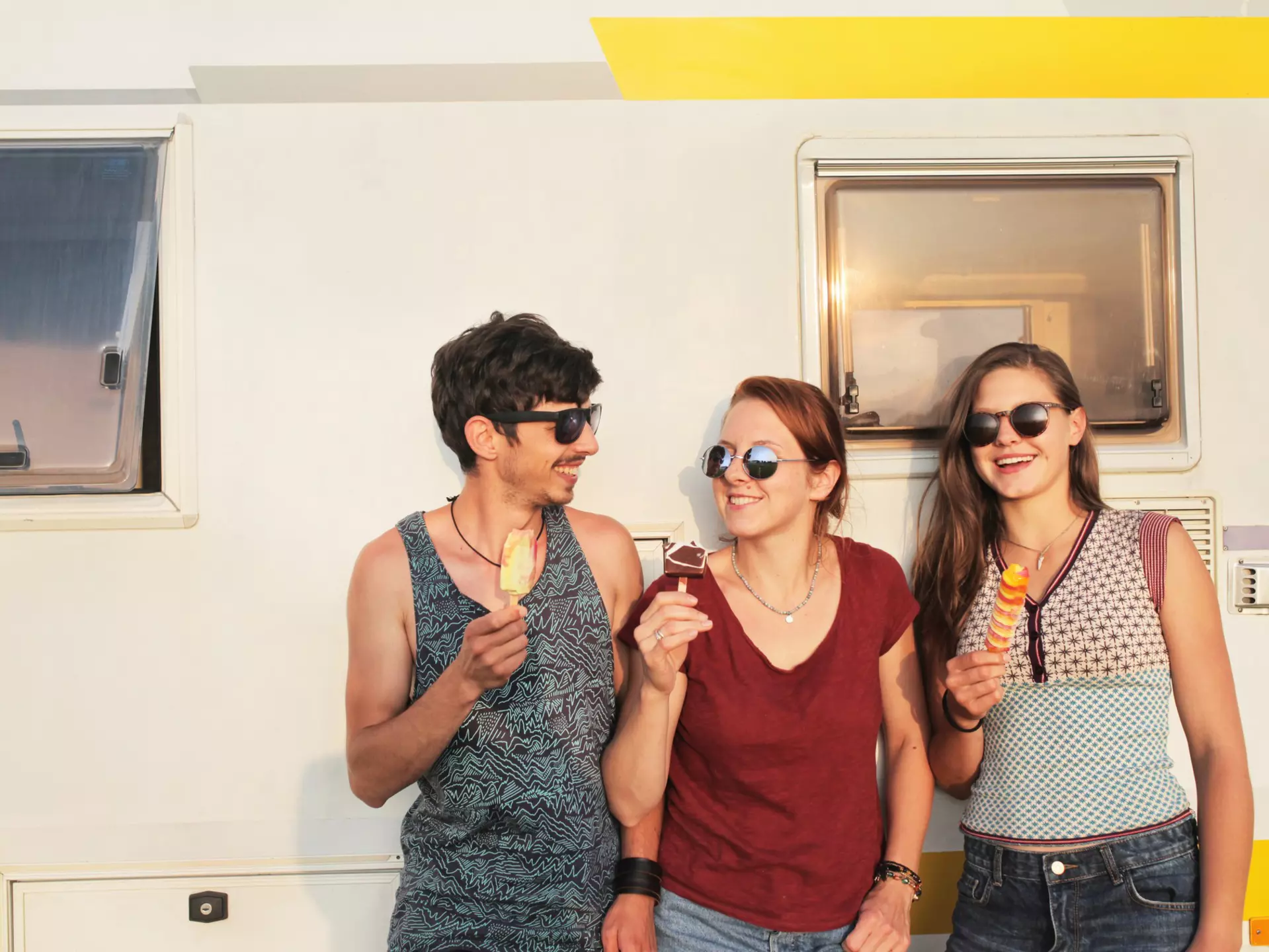 Three friends enjoying ice creams while standing against a campervan.
948843228
Waist Up, Adolescence, Youth Culture, Ice Cream, Sunglasses, One Person, 10-11 Years, Spotted, Getting Away From It All, Casual Clothing, Happiness, Part of a Series, Color Image, Road Trip, Joy, Friendship, Freedom, Three People, Brown Hair, Outdoors, Tank Top, Travel, Beautiful People, Camping, Horizontal, Holding, Caucasian Ethnicity, Adult, Multi Colored, Journey, Norway, Food, Standing, Togetherness, Frozen Food, Top - Garment, Child, Motor Home, Sunset, Side By Side, Enjoyment, Beautiful Woman, Vacations, Cheerful, Teenager, Leisure Activity, Maroon, Transportation, Photography, Pattern, Boys, Bonding, Teenage Boys, Looking Away, Lifestyles, Young Adult, Teenage Girls, Candid, 14-15 Years, Front View, Long Hair, Young Women, People, Weekend Activities, Toothy Smile