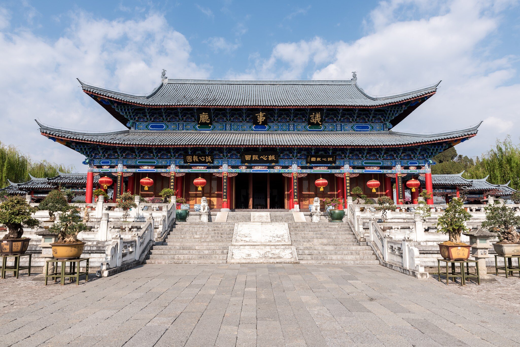 Exterior view of Mu Residence, with stairs leading up to the entrance of Mu mansion in Lijiang, China.