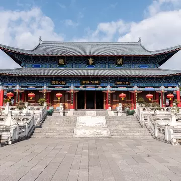 Exterior view of Mu Residence, with stairs leading up to the entrance of Mu mansion in Lijiang, China.