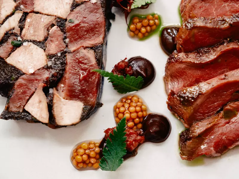 Nielsen RestaurantThe Reindeer Duo: Reindeer terrine, chives, and mushrooms & reindeer tatki garlic mayo, pickled berrie  Nielsen restaurant