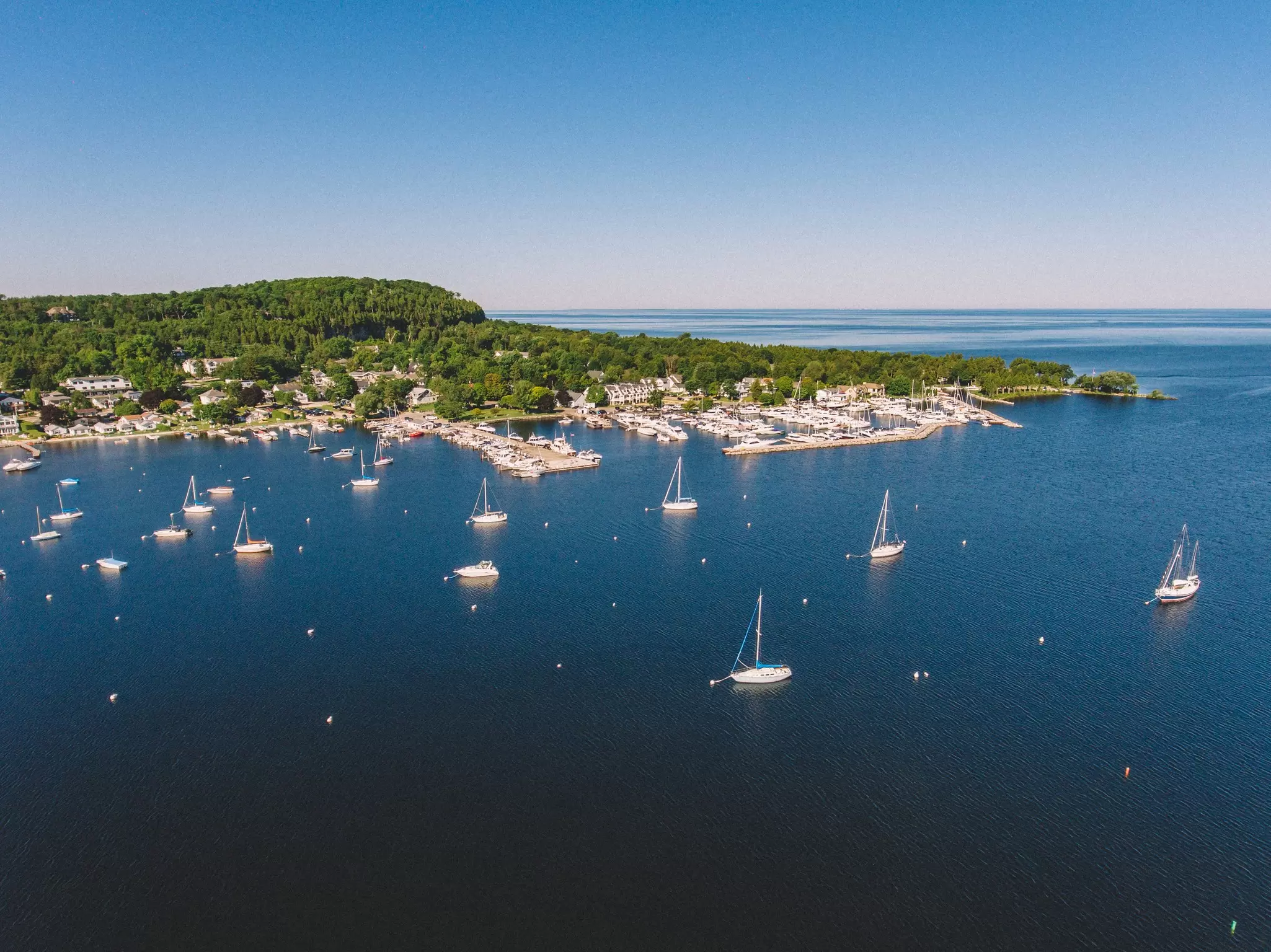 For those who love the outdoors, Door County, Wisconsin has plenty to do, such as sailing in Fish Creek Harbor. Matt Sampson Photography/Getty Images