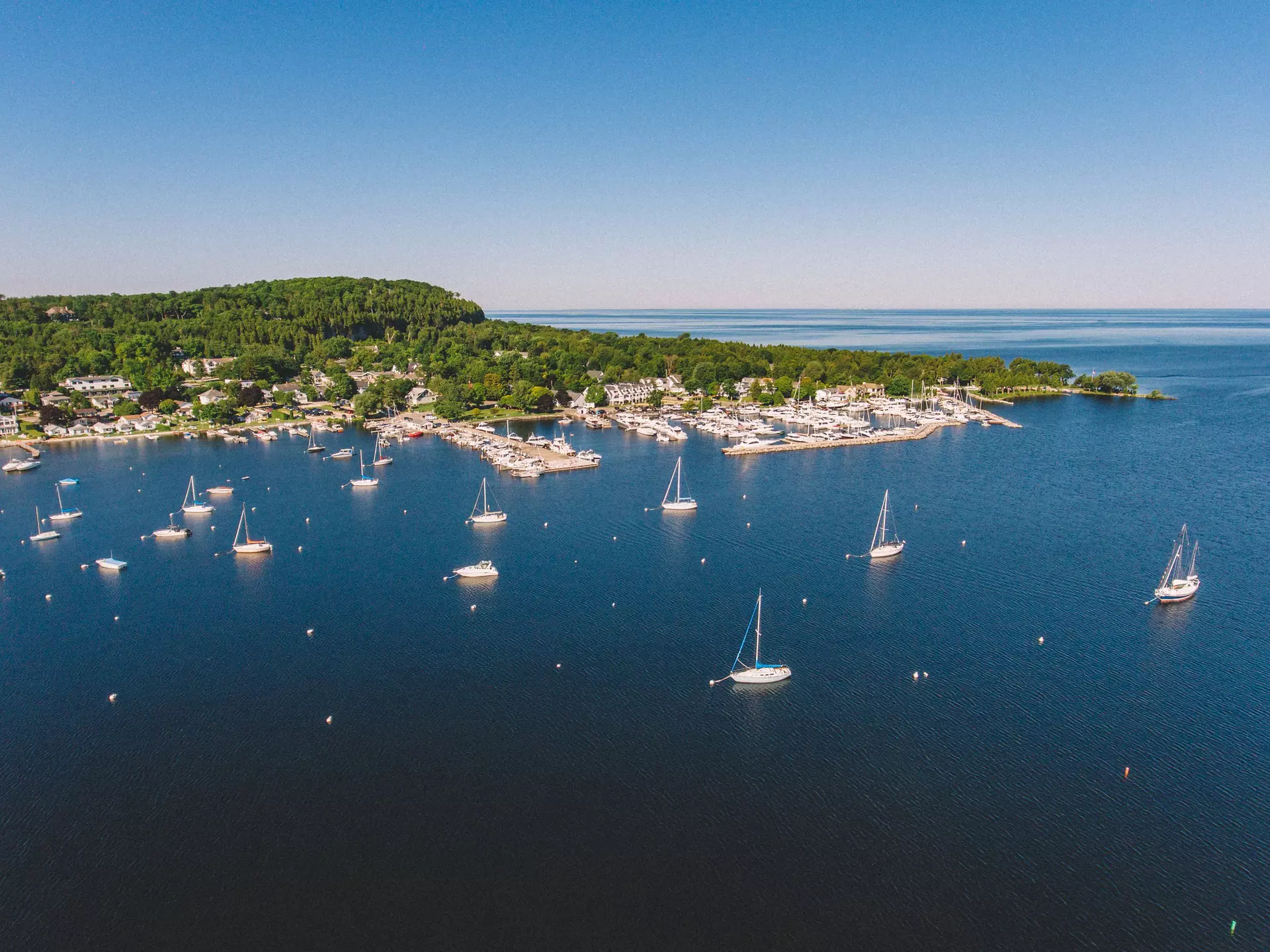 For those who love the outdoors, Door County, Wisconsin has plenty to do, such as sailing in Fish Creek Harbor. Matt Sampson Photography/Getty Images