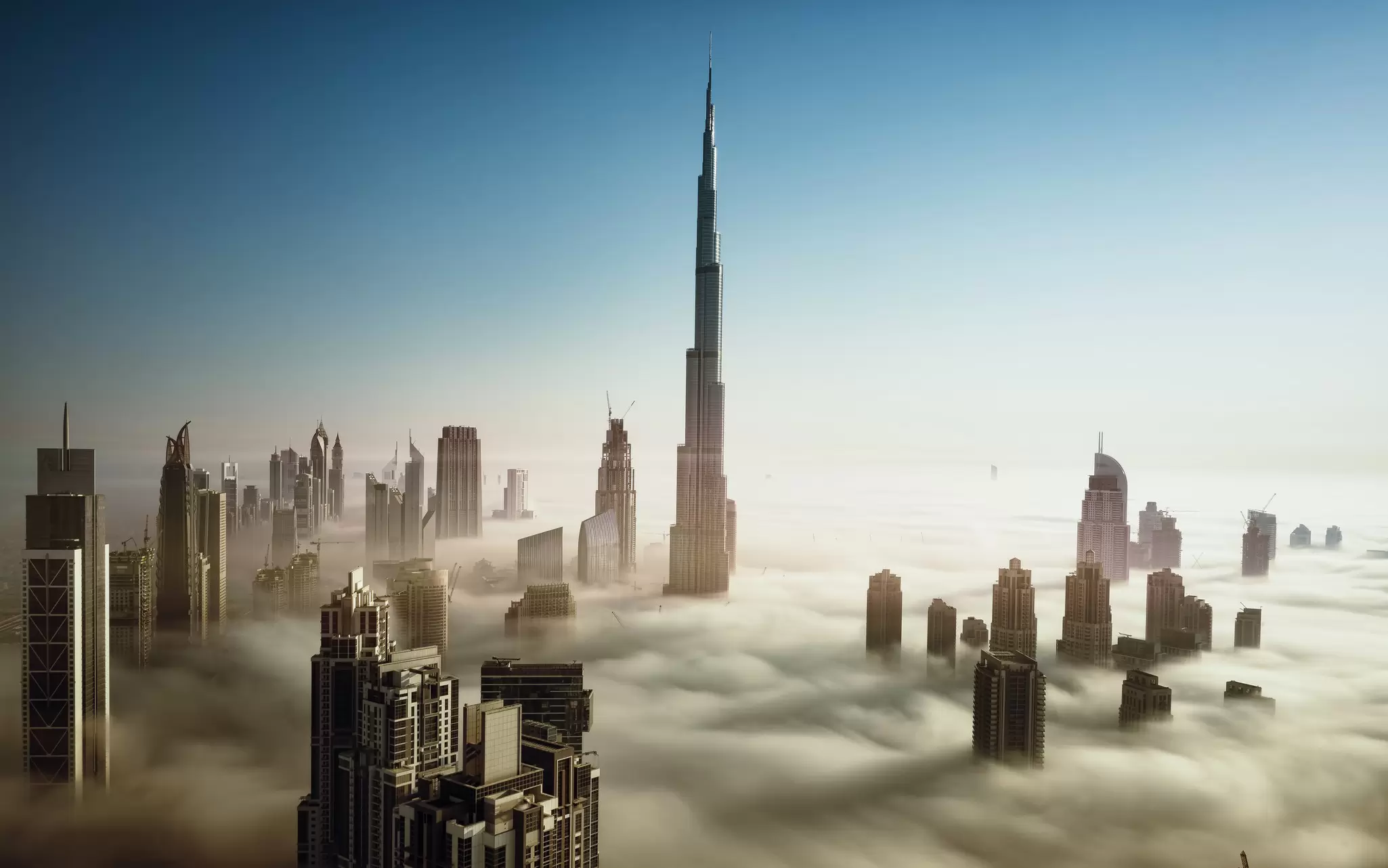 Skyline of Dubai in early morning fog