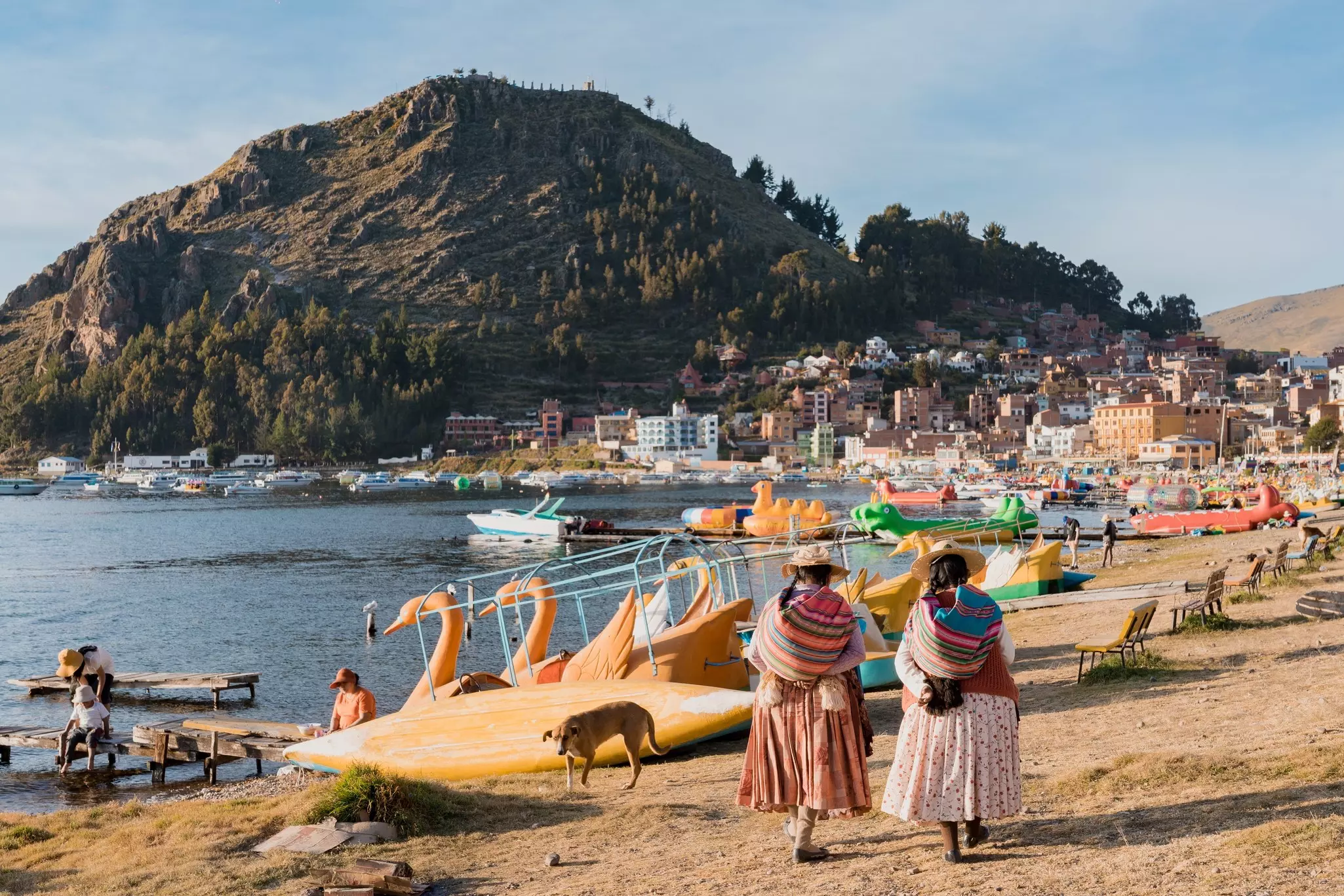 Bolivians in traditional clothes by Lake Titicaca, Copacabana, Bolivia.