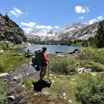 A backpacker in Little Lakes Valley, John Muir Wilderness in California. Jimmy W/Shutterstock