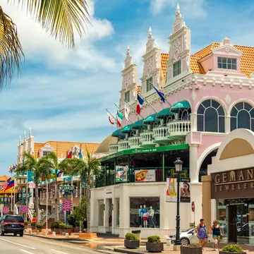 ORANJESTAD, ARUBA - JULY 25, 2017: Lloyd G. Smith Boulevard on a summer day. This main thoroughfare in the city has recently become an important shopping area., License Type: media, Download Time: 2025-11-20T11:59:10.000Z, User: clairenaylor, Editorial: true, purchase_order: 65050 - Digital Destinations and Articles, job: Online editorial, client: Aruba day drive, other: Claire Naylor