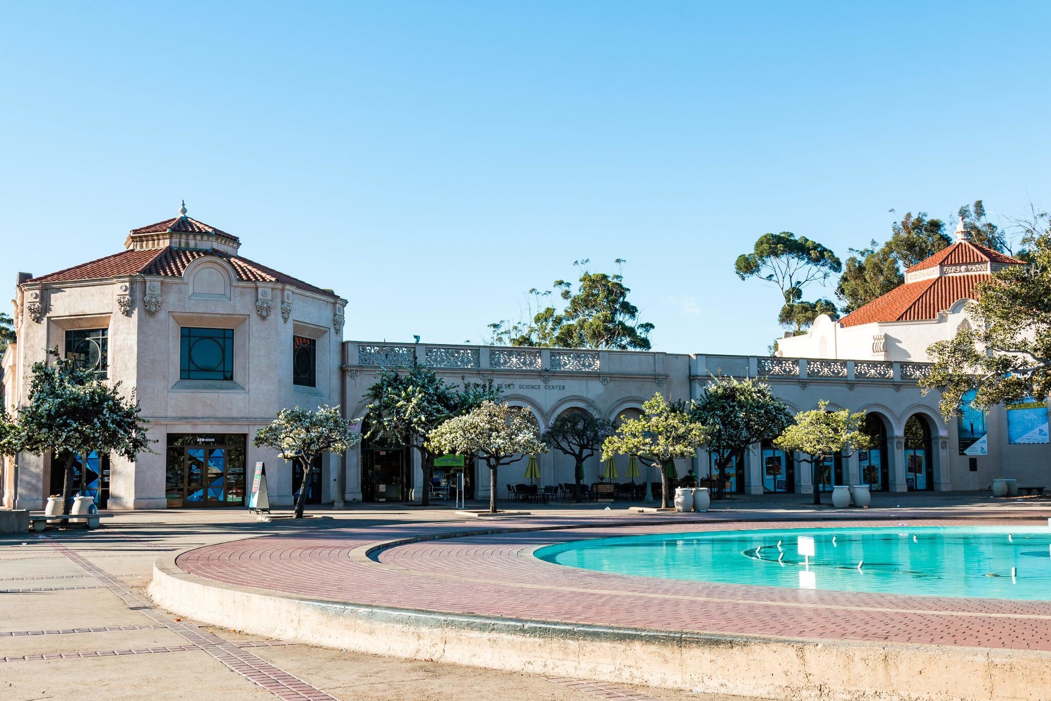 SAN DIEGO, CALIFORNIA - FEBRUARY 17, 2018: The Fleet Science Center, a science museum and planetarium, along with the historic Bea Evenson fountain, both located in Balboa Park, an urban city park.; Shutterstock ID 1027097284; your: Bridget Brown;...