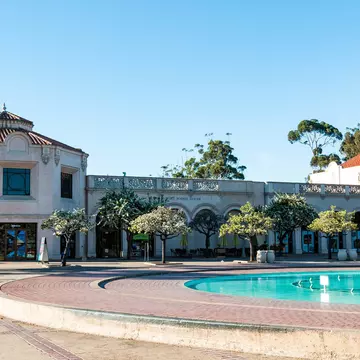 SAN DIEGO, CALIFORNIA - FEBRUARY 17, 2018: The Fleet Science Center, a science museum and planetarium, along with the historic Bea Evenson fountain, both located in Balboa Park, an urban city park.; Shutterstock ID 1027097284; your: Bridget Brown;...